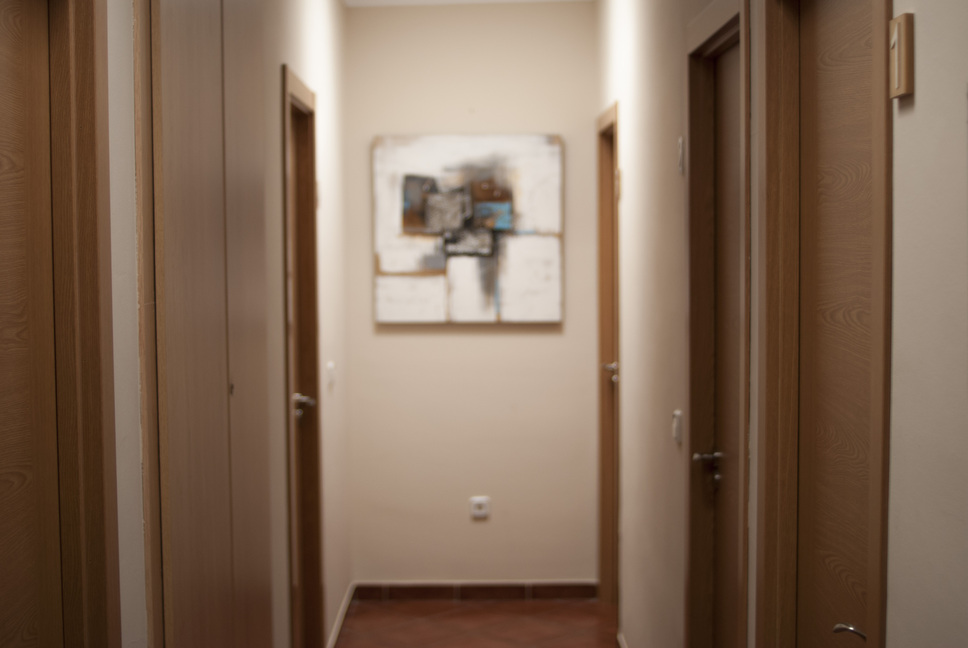 Hallway of the hostal with a painting in the background