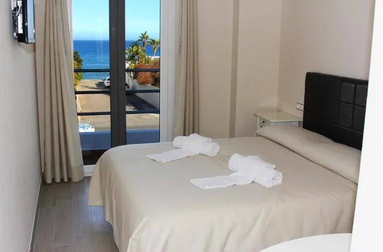 Double bed with balcony view